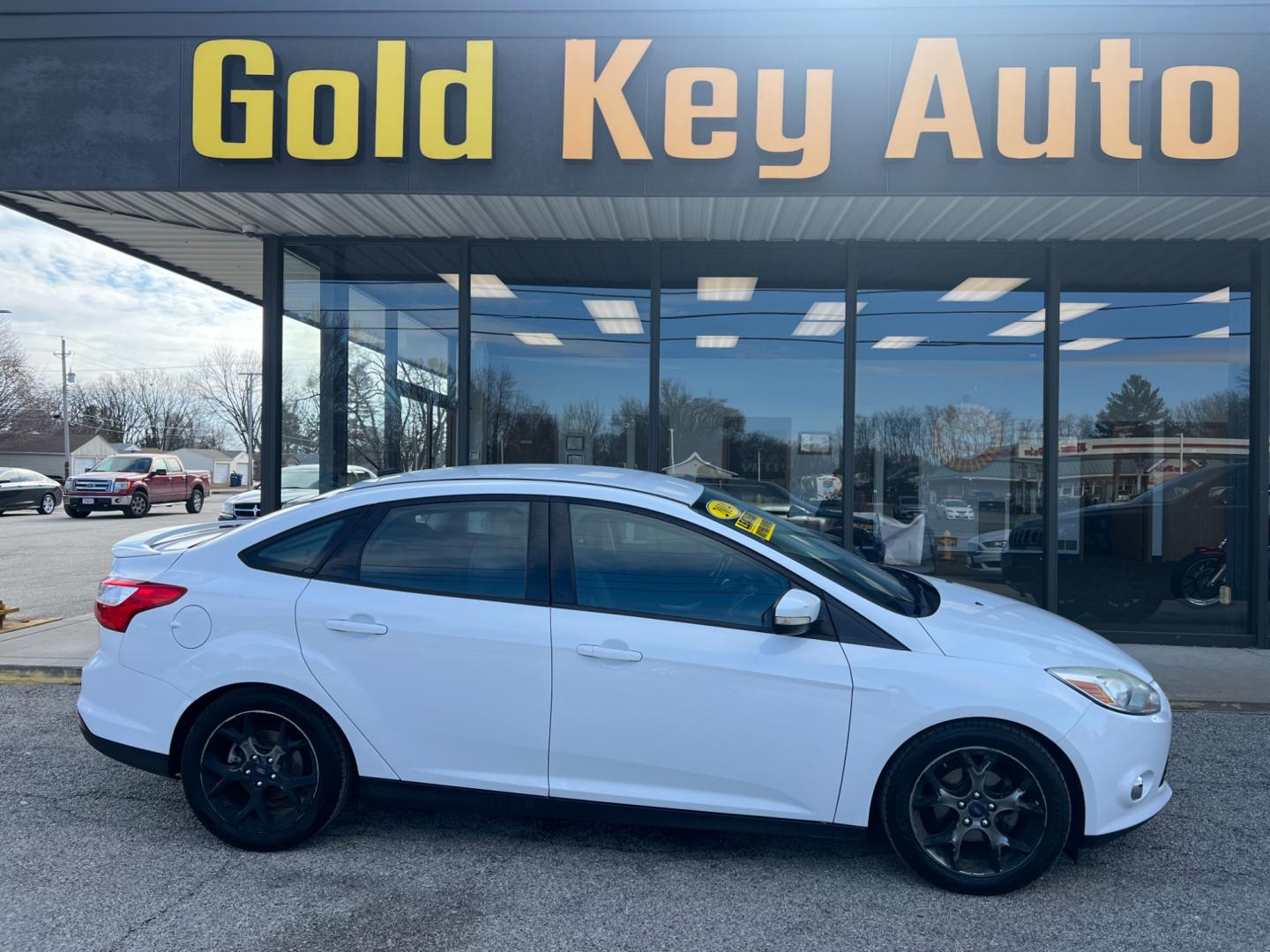 2014 Oxford White Ford Focus SE Sedan (1FADP3F26EL) with an 2.0L L4 DOHC 16V engine, 6-Speed Automatic transmission, located at 1633 W Kimberly, Davenport, IA, 52806, (563) 323-5341, 41.559456, -90.598732 - Photo#0